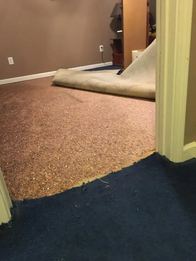 Carpet pad removal revealing water damage during Drying & Dehumidification in East Honolulu